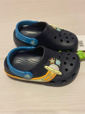 CROCS Kids Navy Light Up Clogs with Blue Straps and Orange-Yellow Space Accents